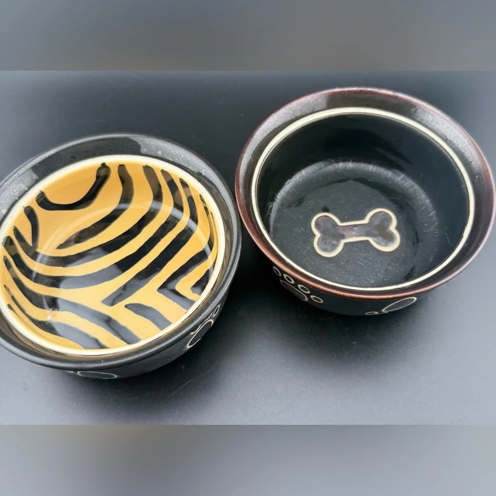 2 small dog dishes. Chic tiger print and bone print. 5”